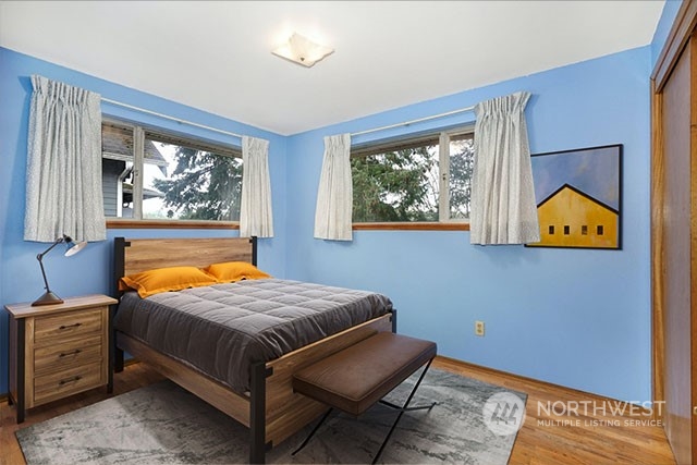 4151 23rd Avenue Southwest Seattle, WA 98106 - Photo 16 of 36 a bedroom with a bed and a window