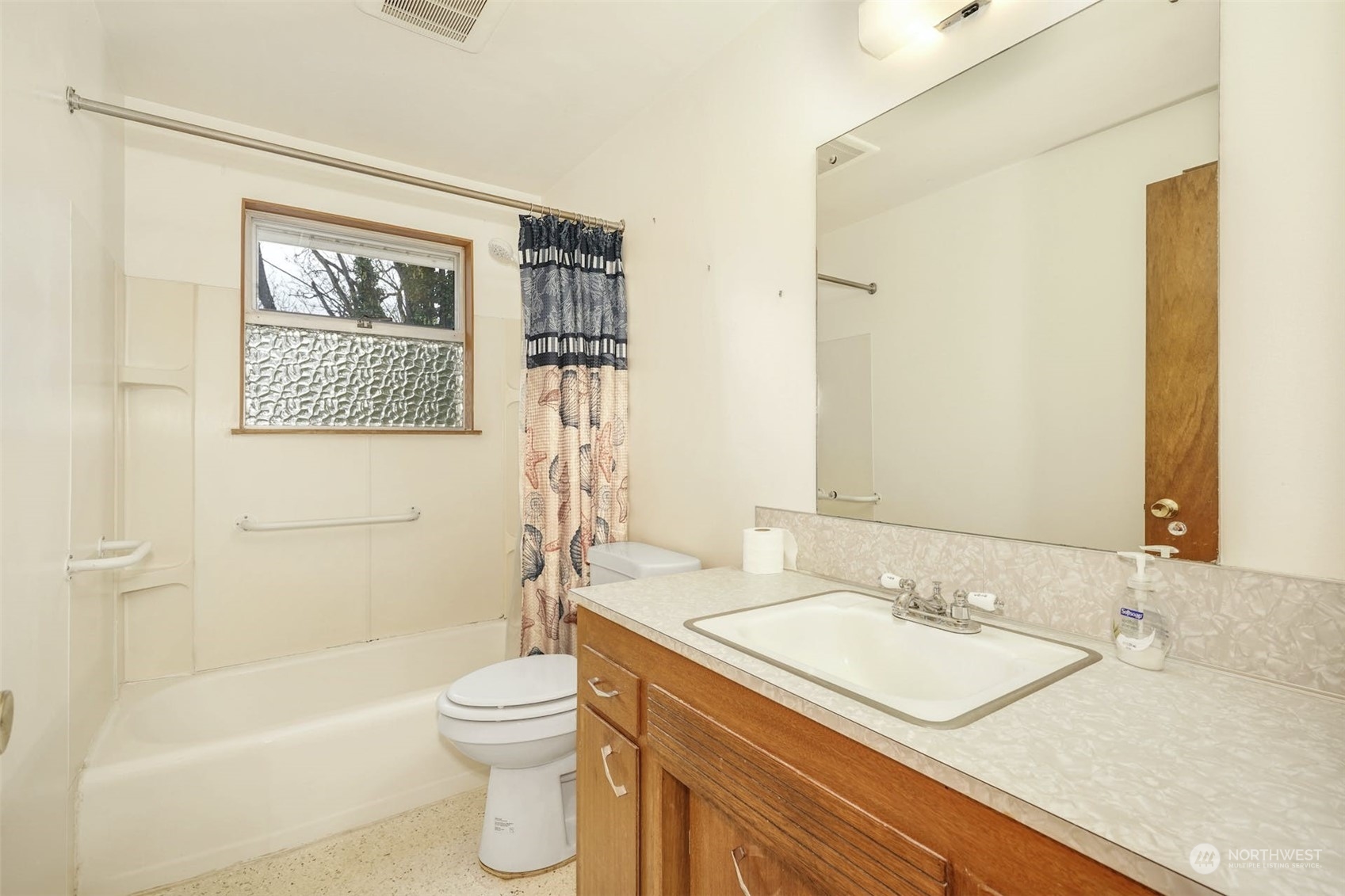 4151 23rd Avenue Southwest Seattle, WA 98106 - Photo 22 of 36 a bathroom with a granite countertop sink toilet and shower