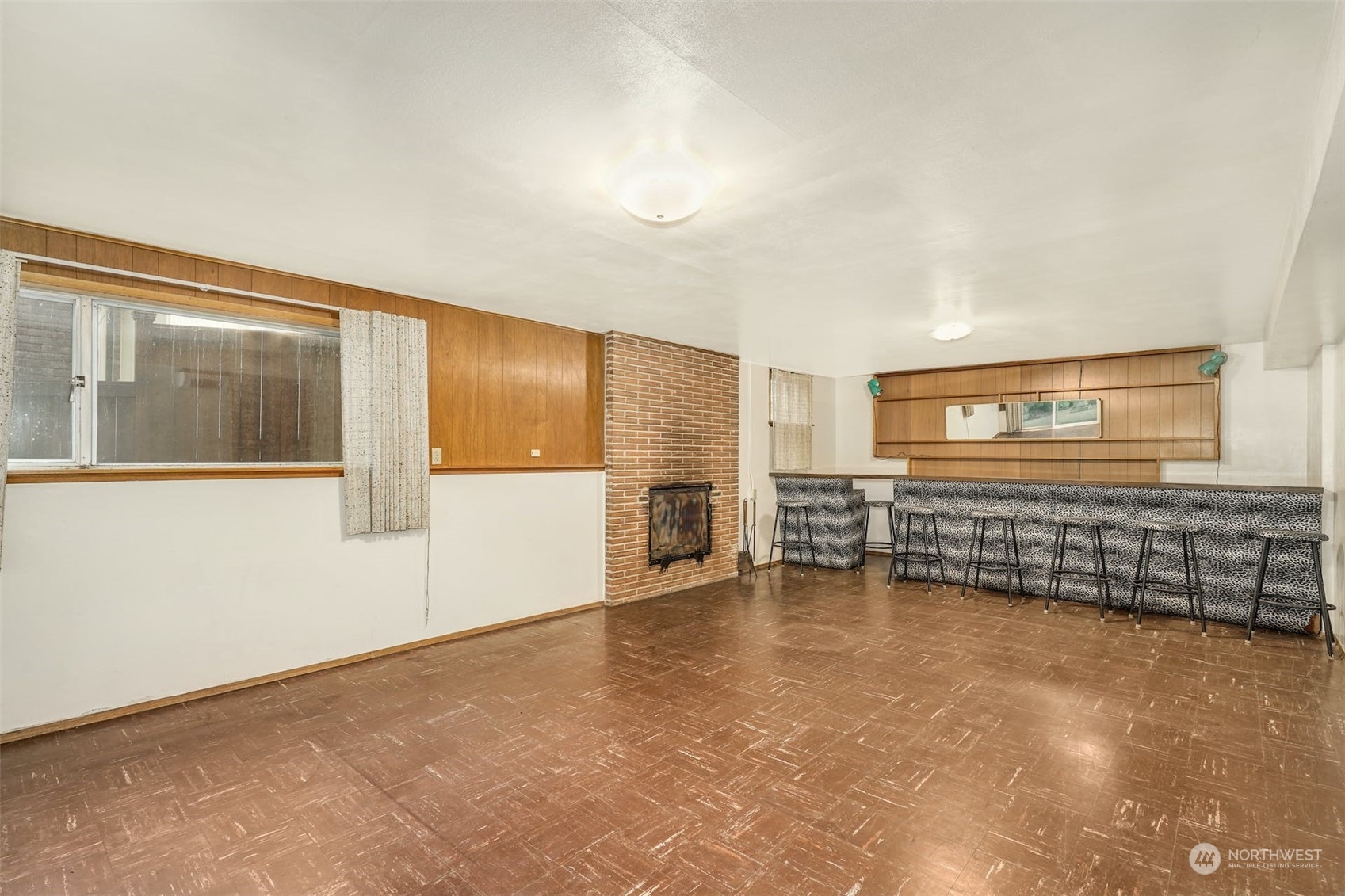 4151 23rd Avenue Southwest Seattle, WA 98106 - Photo 25 of 36 a view of an empty room with a fireplace and a window