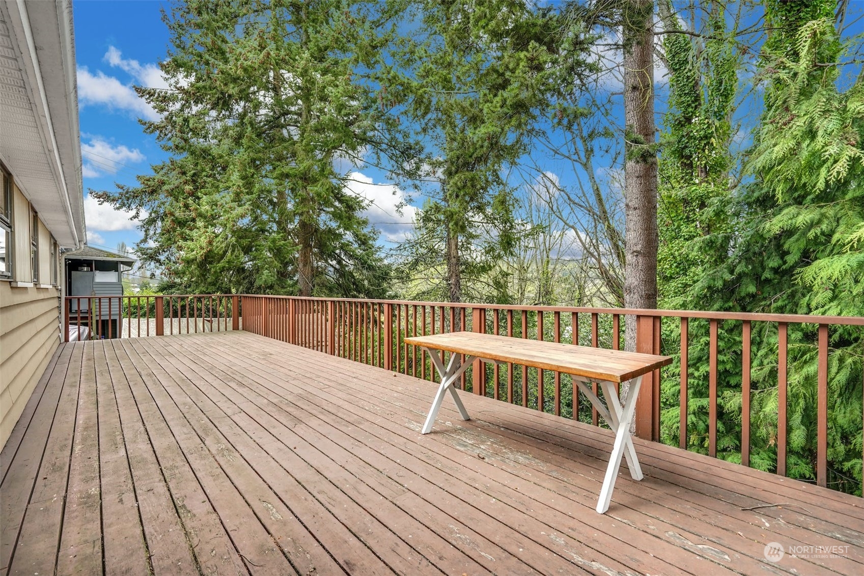 4151 23rd Avenue Southwest Seattle, WA 98106 - Photo 34 of 36 a balcony with wooden floor table and chairs