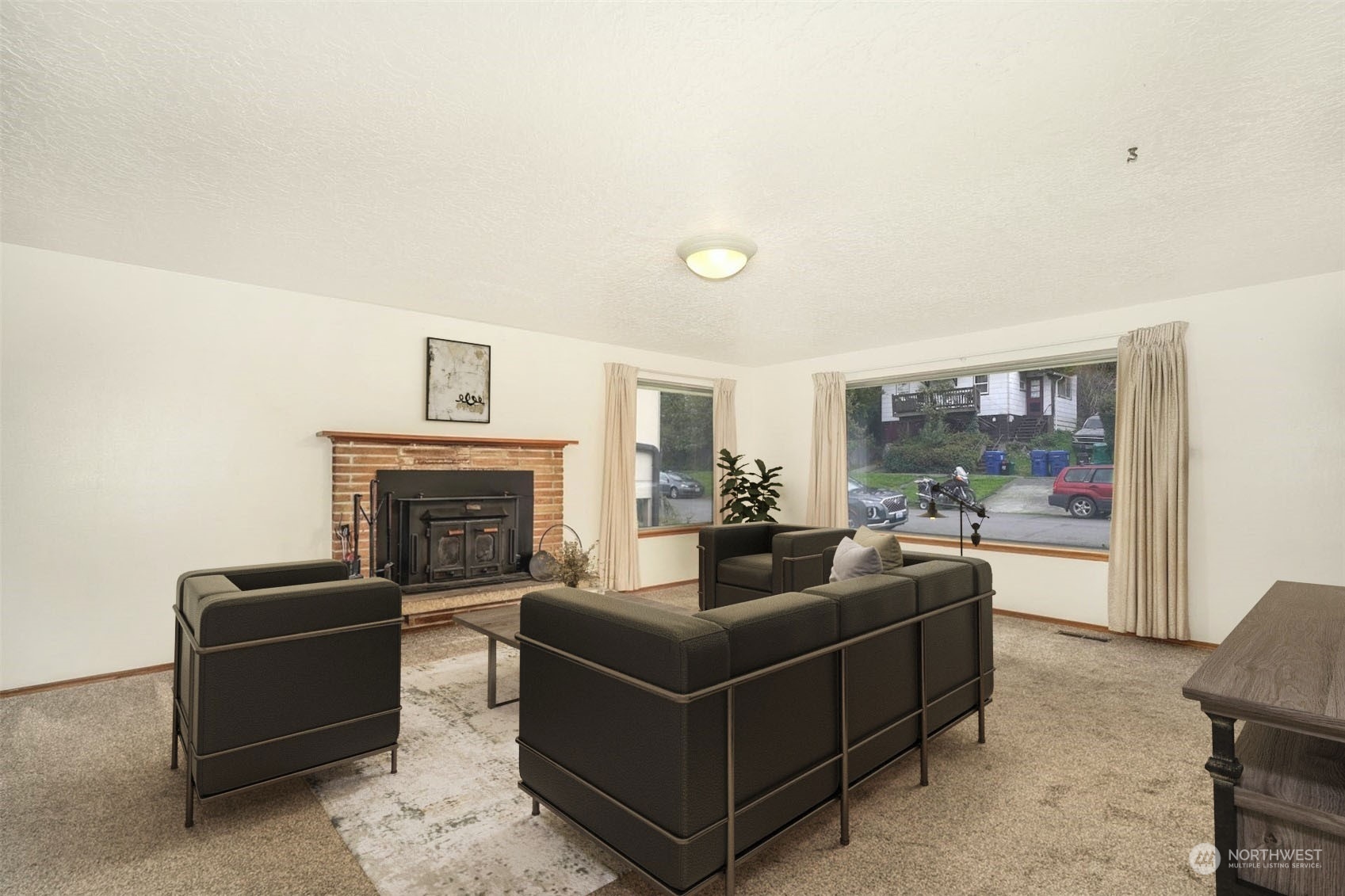 4151 23rd Avenue Southwest Seattle, WA 98106 - Photo 6 of 36 a living room with furniture and a fireplace