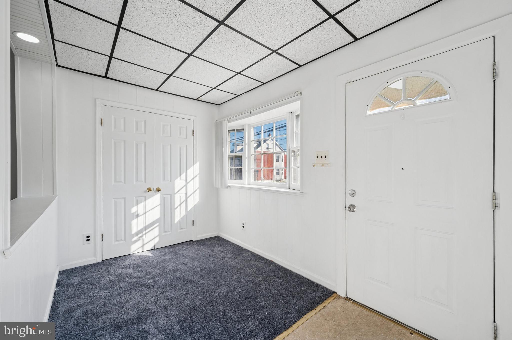 103 Chestnut Street Darby, PA 19023 - Photo 3 of 15 Enclosed porch with coat closet and front window