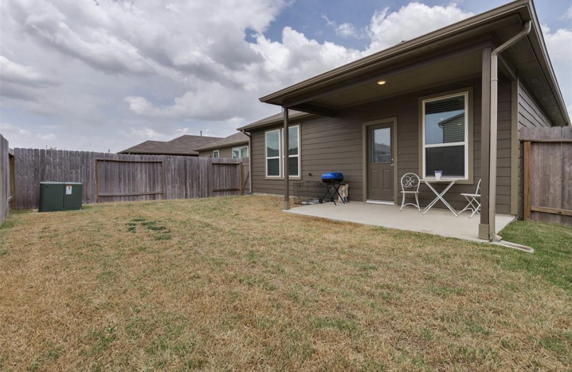25535 Pitchfork Ranch Place Katy, TX 77493 - Photo 12 of 25 a view of a house with backyard and a table