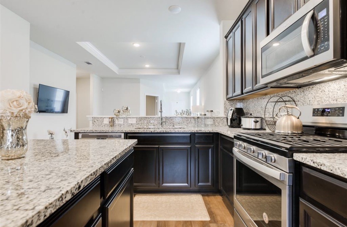 25535 Pitchfork Ranch Place Katy, TX 77493 - Photo 25 of 25 a kitchen with granite countertop stainless steel appliances and sink