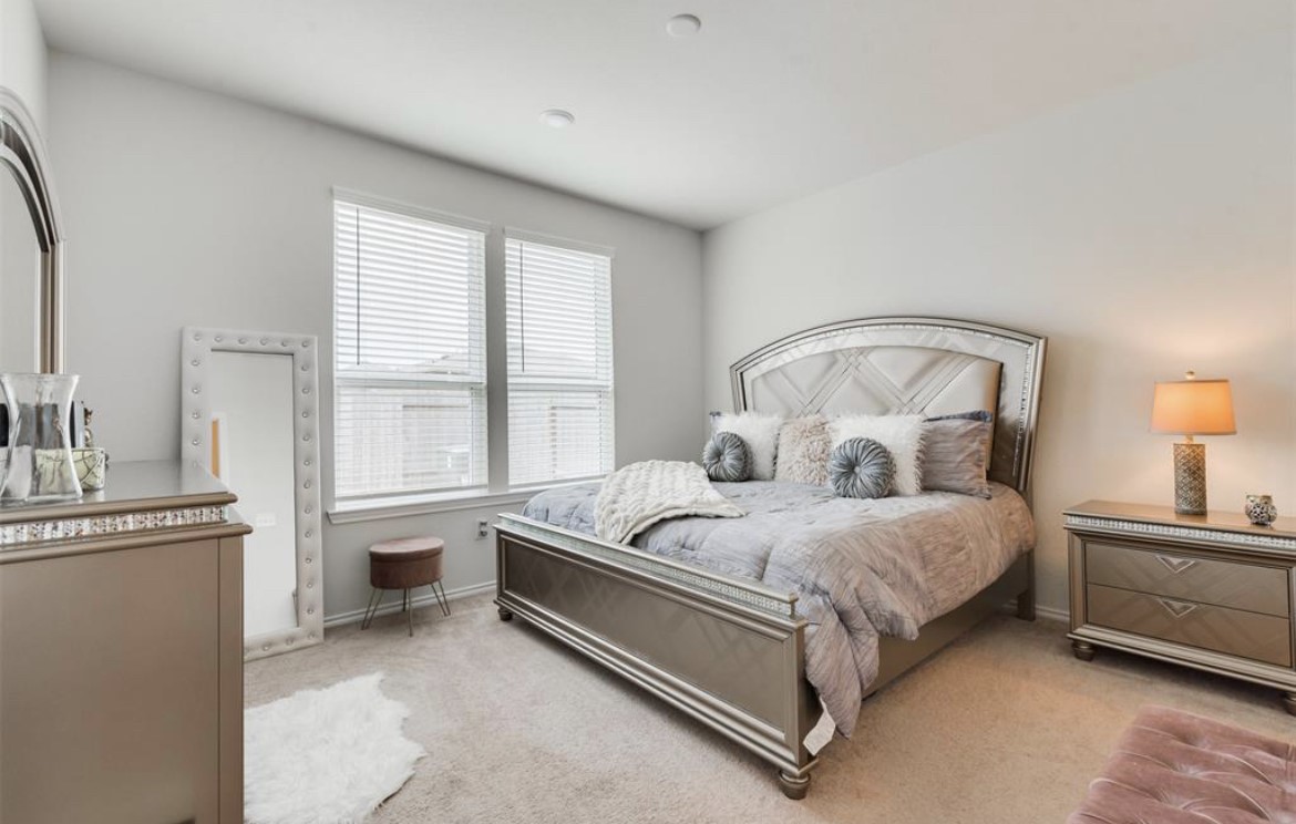25535 Pitchfork Ranch Place Katy, TX 77493 - Photo 6 of 25 a bedroom with a bed and a window