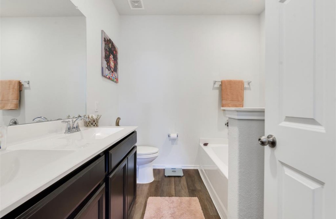 25535 Pitchfork Ranch Place Katy, TX 77493 - Photo 7 of 25 a bathroom with a sink and a mirror