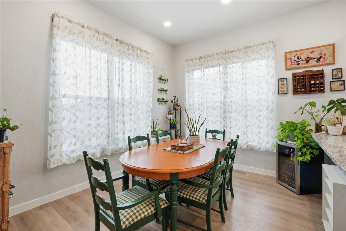 7416 30th Street Lubbock, TX 79407 - Photo 13 of 31 a dining room with furniture and wooden floor