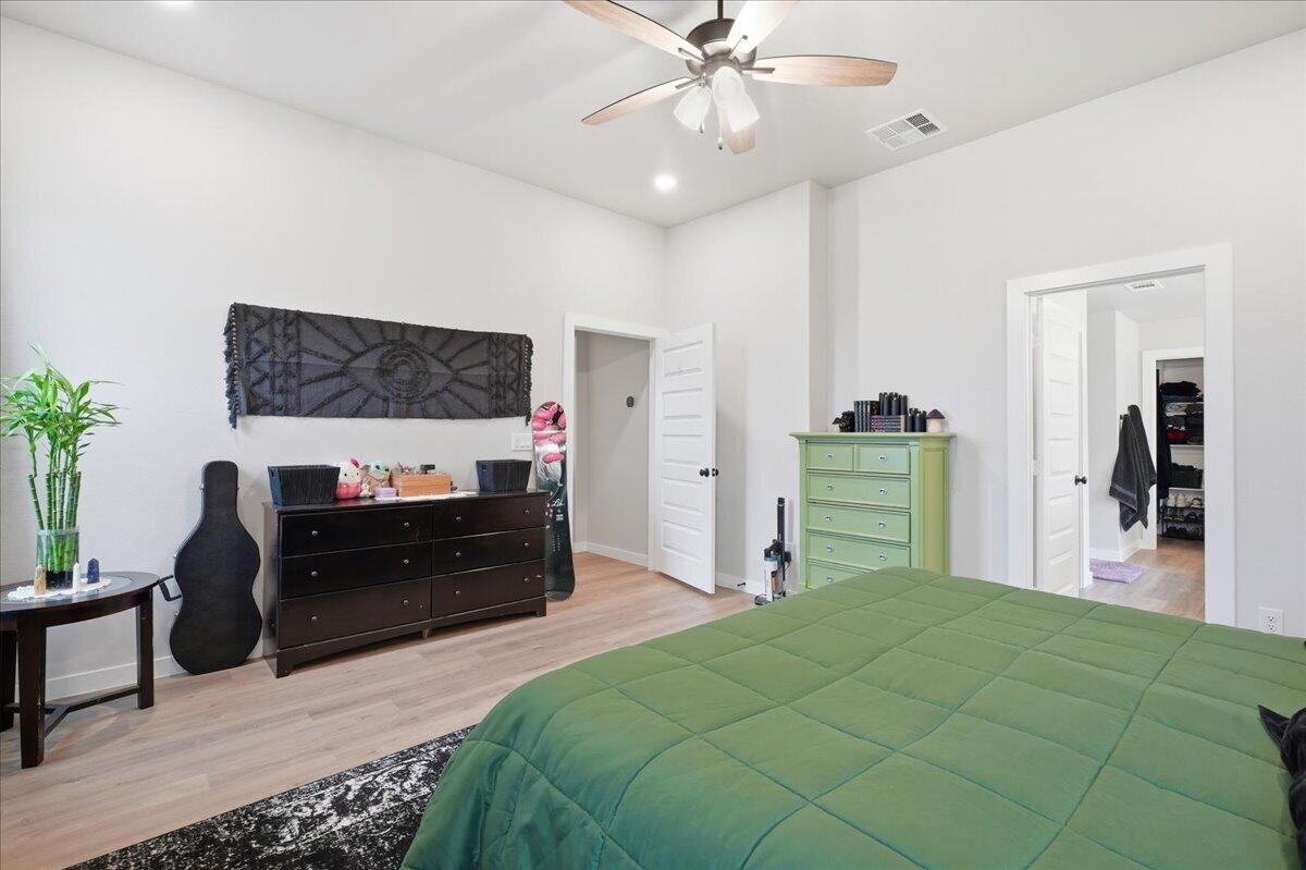 7416 30th Street Lubbock, TX 79407 - Photo 16 of 31 a bed room with a bed and a television