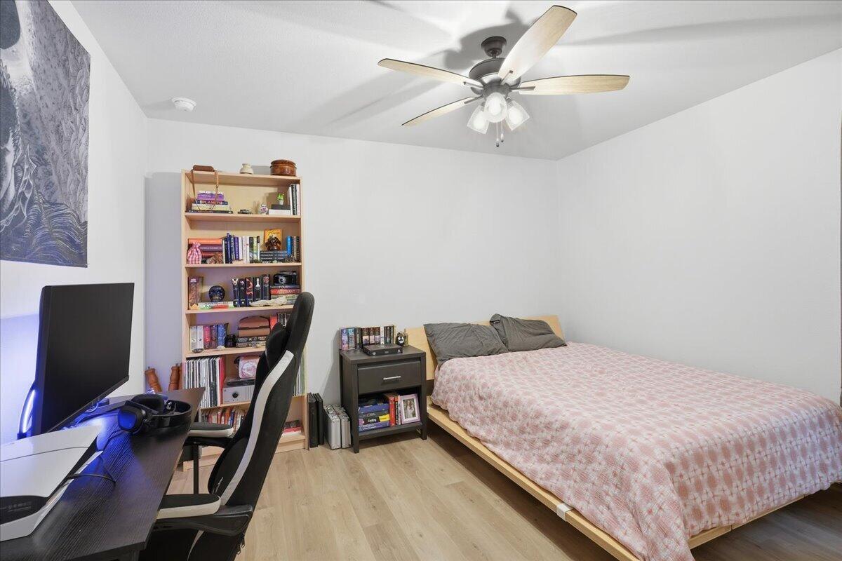 7416 30th Street Lubbock, TX 79407 - Photo 27 of 31 a bedroom with a bed and a flat screen tv