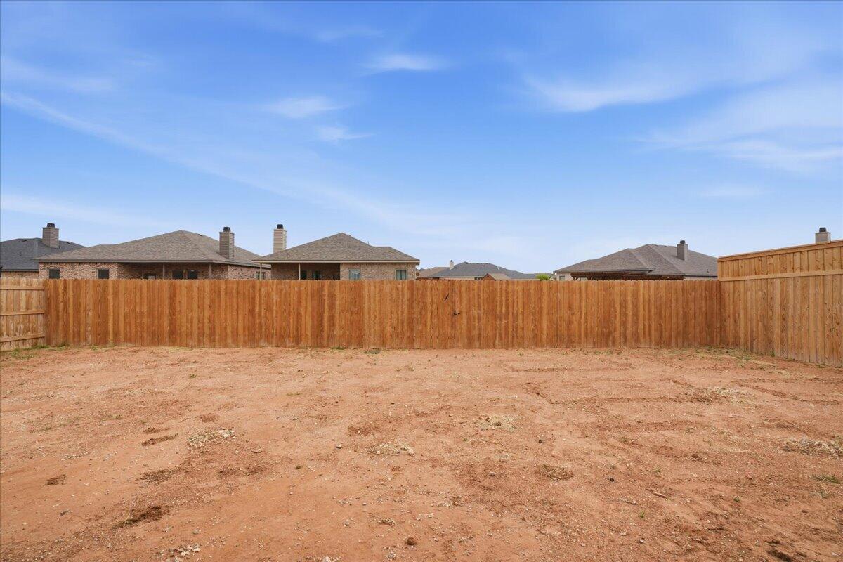 7416 30th Street Lubbock, TX 79407 - Photo 30 of 31 a view of a lake with mountain in the background