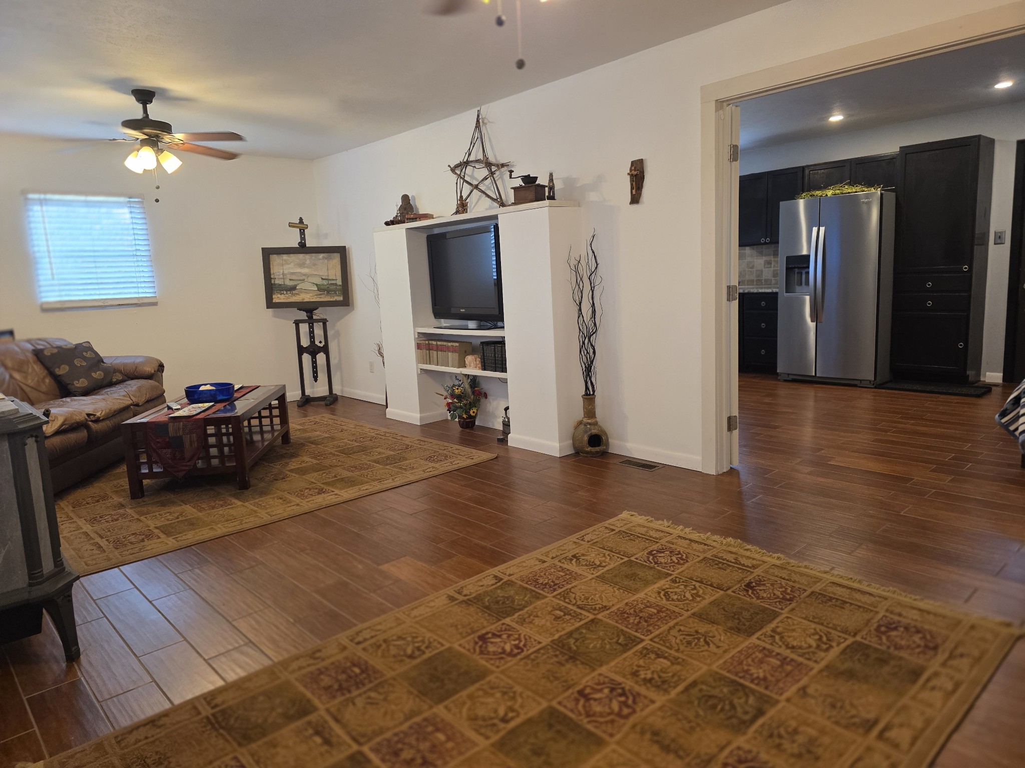 7690 Barnhill Road Primm Springs, TN 38476 - Photo 12 of 50 a living room with furniture and a flat screen tv