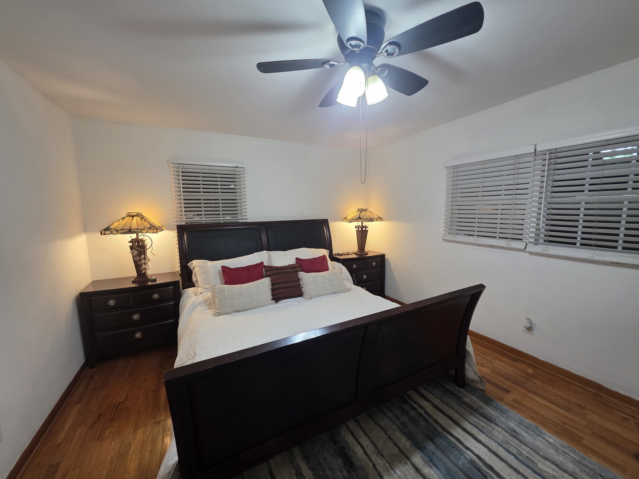 7690 Barnhill Road Primm Springs, TN 38476 - Photo 17 of 50 a bedroom with a bed and a chandelier