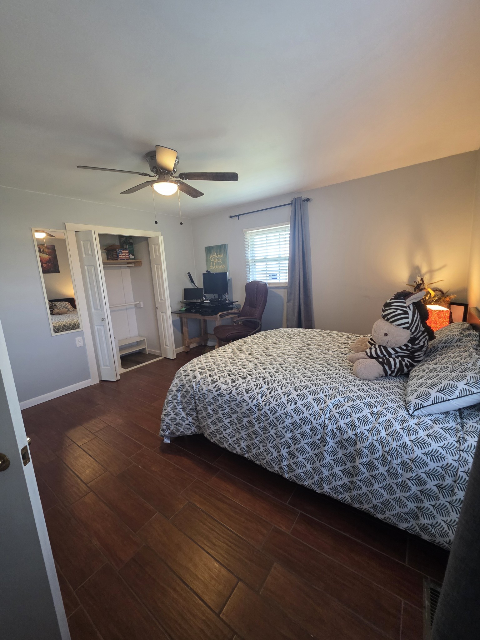 7690 Barnhill Road Primm Springs, TN 38476 - Photo 22 of 50 a bedroom with a bed and a chandelier