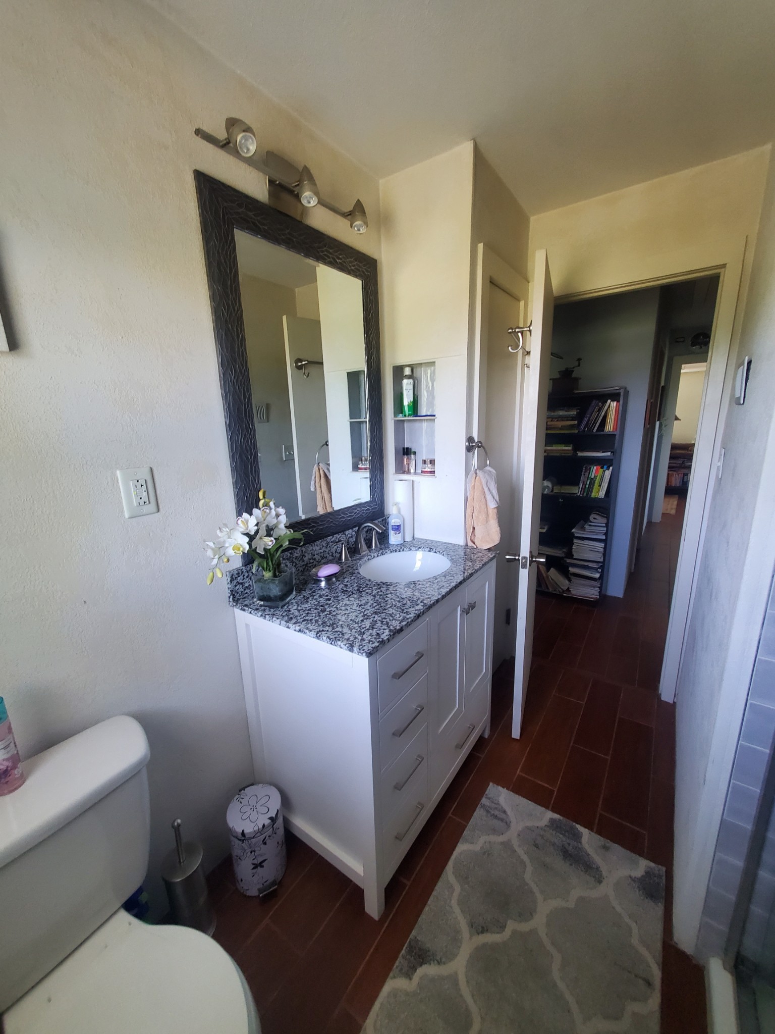 7690 Barnhill Road Primm Springs, TN 38476 - Photo 26 of 50 a bathroom with a granite countertop sink and a mirror