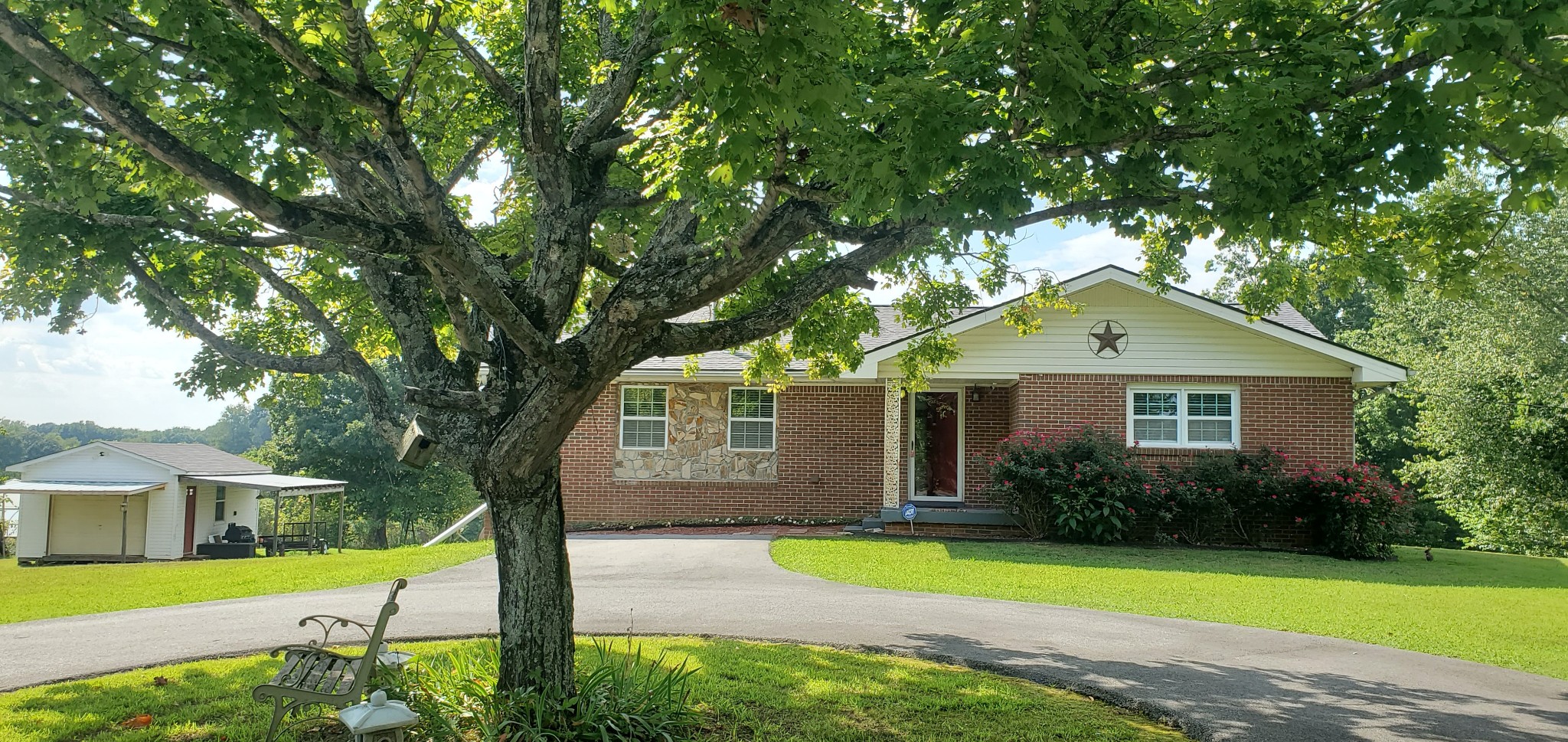 7690 Barnhill Road Primm Springs, TN 38476 - Photo 3 of 50 a front view of a house with yard and green space