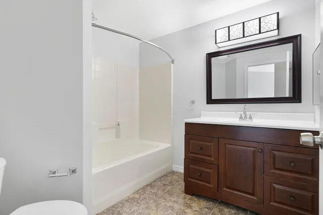 a bathroom with a toilet a sink and bathtub