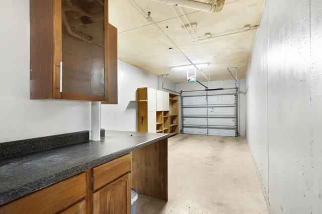 a kitchen with cabinets and window