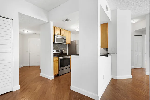 a view of kitchen and wooden floor