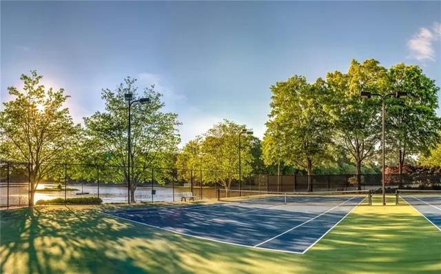 a view of a swimming pool with an outdoor space and seating area