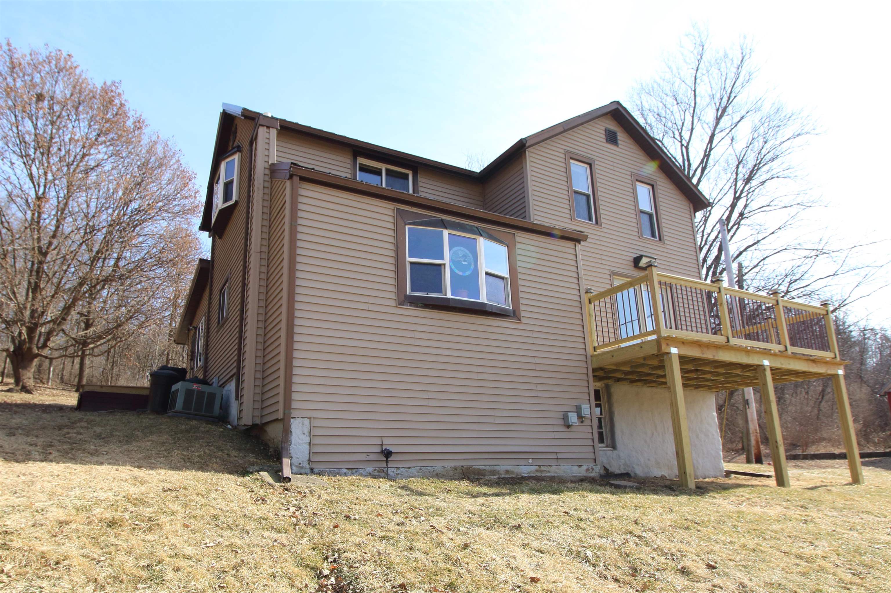 17896 Skunk Hollow Road Mount Carroll, IL 61053 - Photo 31 of 36 a view of a house with a yard