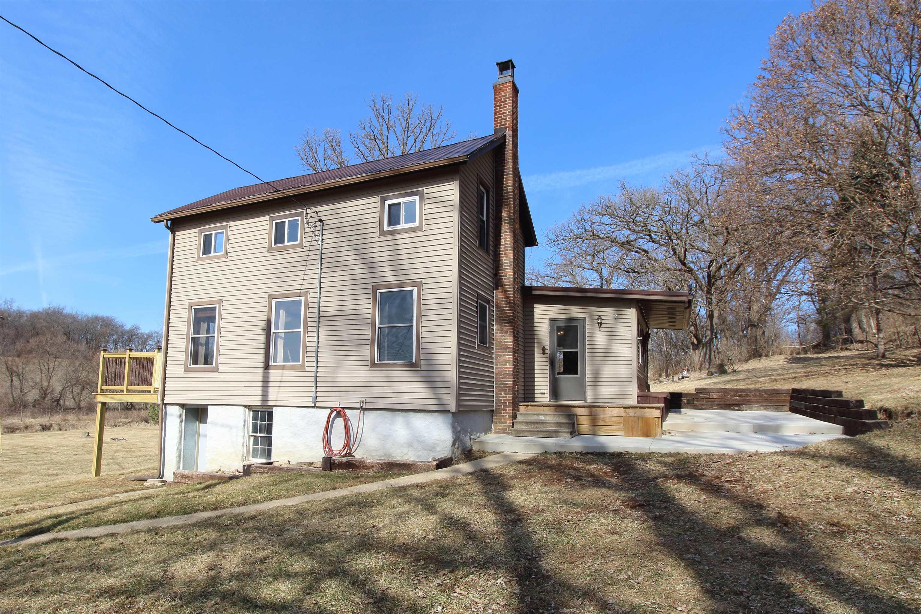 17896 Skunk Hollow Road Mount Carroll, IL 61053 - Photo 32 of 36 a front view of a house with a yard