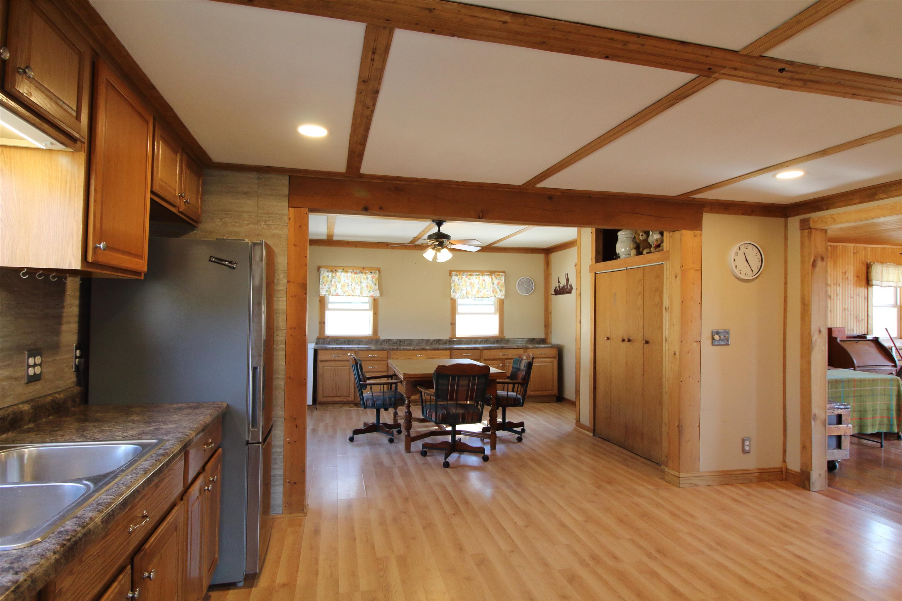 17896 Skunk Hollow Road Mount Carroll, IL 61053 - Photo 35 of 36 a view of a kitchen with dining table and chairs