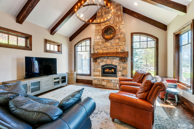 811 South High Ridge Drive Alpine, UT 84004 - Photo 11 of 98 Living room featuring a fireplace and a chandelier
