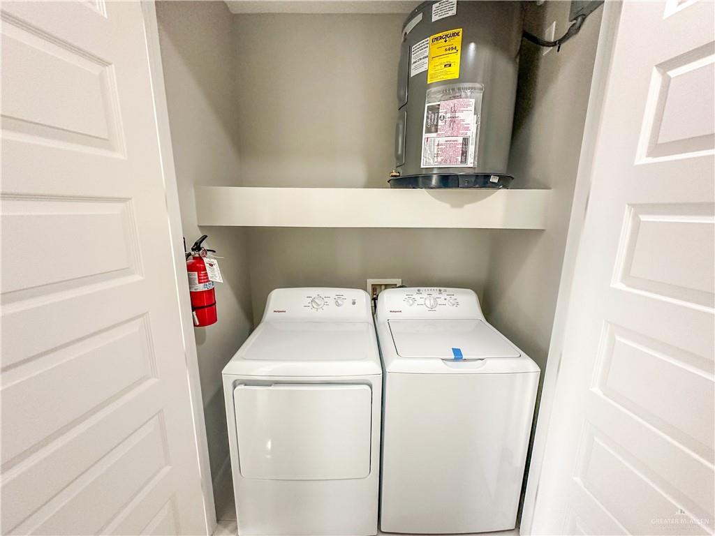 2002 East 1st Street, Unit 2 Mission, TX 78572 - Photo 13 of 15 Laundry area featuring water heater and separate washer and dryer