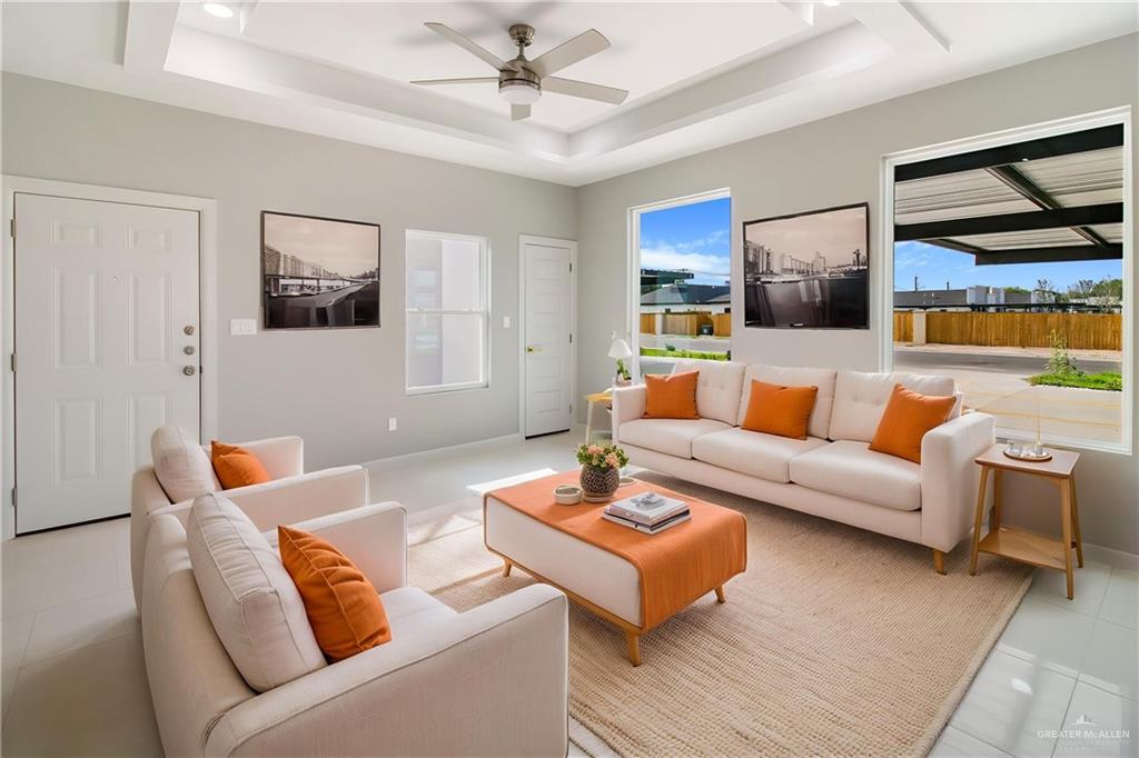 2002 East 1st Street, Unit 2 Mission, TX 78572 - Photo 6 of 15 Living area with light tile patterned floors and a ceiling fan-property is virtually staged