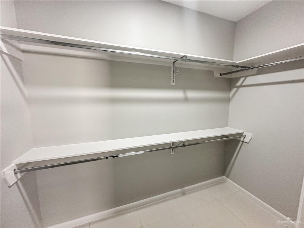 2002 East 1st Street, Unit 2 Mission, TX 78572 - Photo 9 of 15 Walk in closet with light tile patterned floors