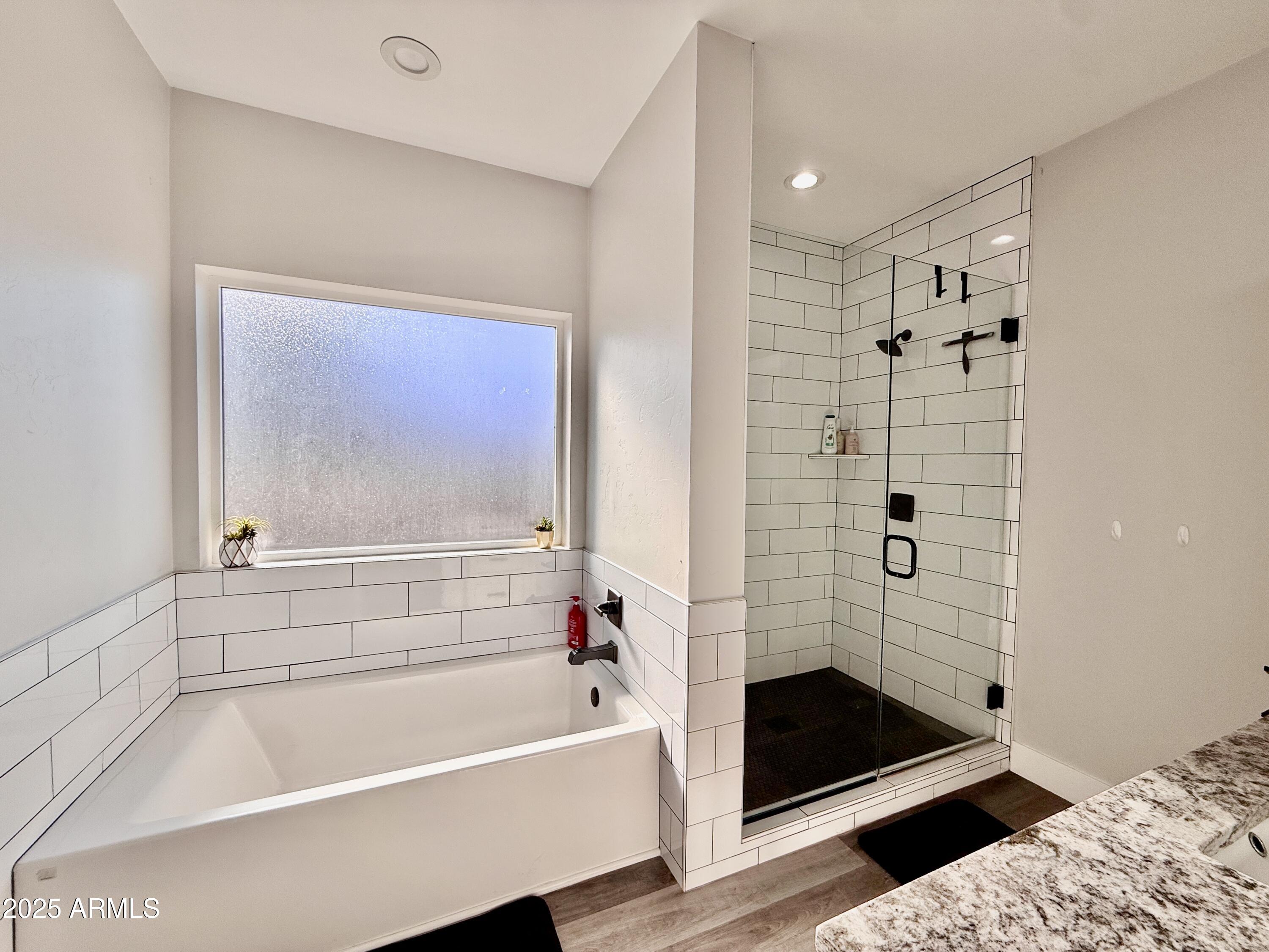 640 South 600 West Pima, AZ 85543 - Photo 11 of 22 a bathroom with a bathtub and shower