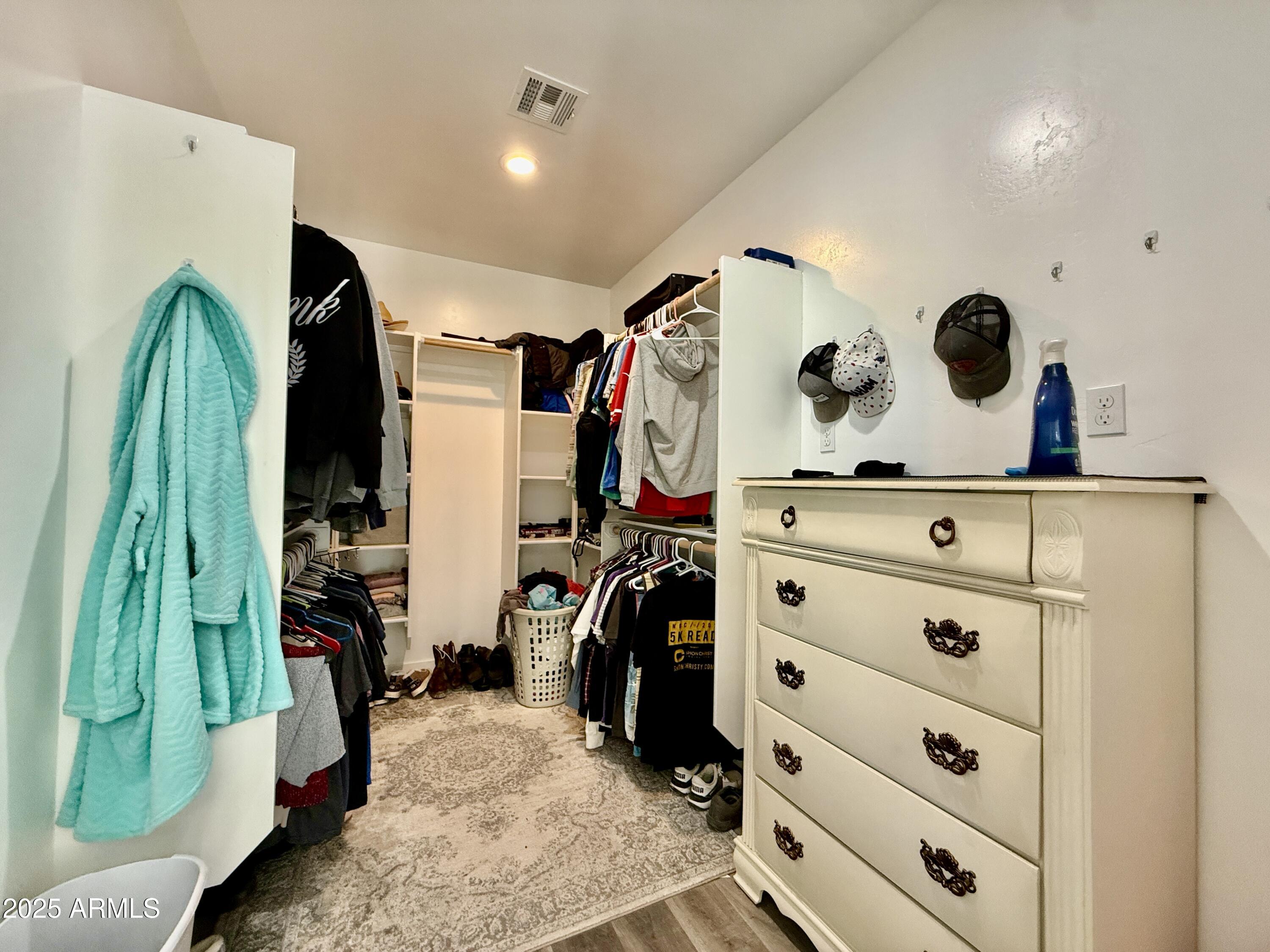 640 South 600 West Pima, AZ 85543 - Photo 12 of 22 a view of walk in closet with clothes and shoes