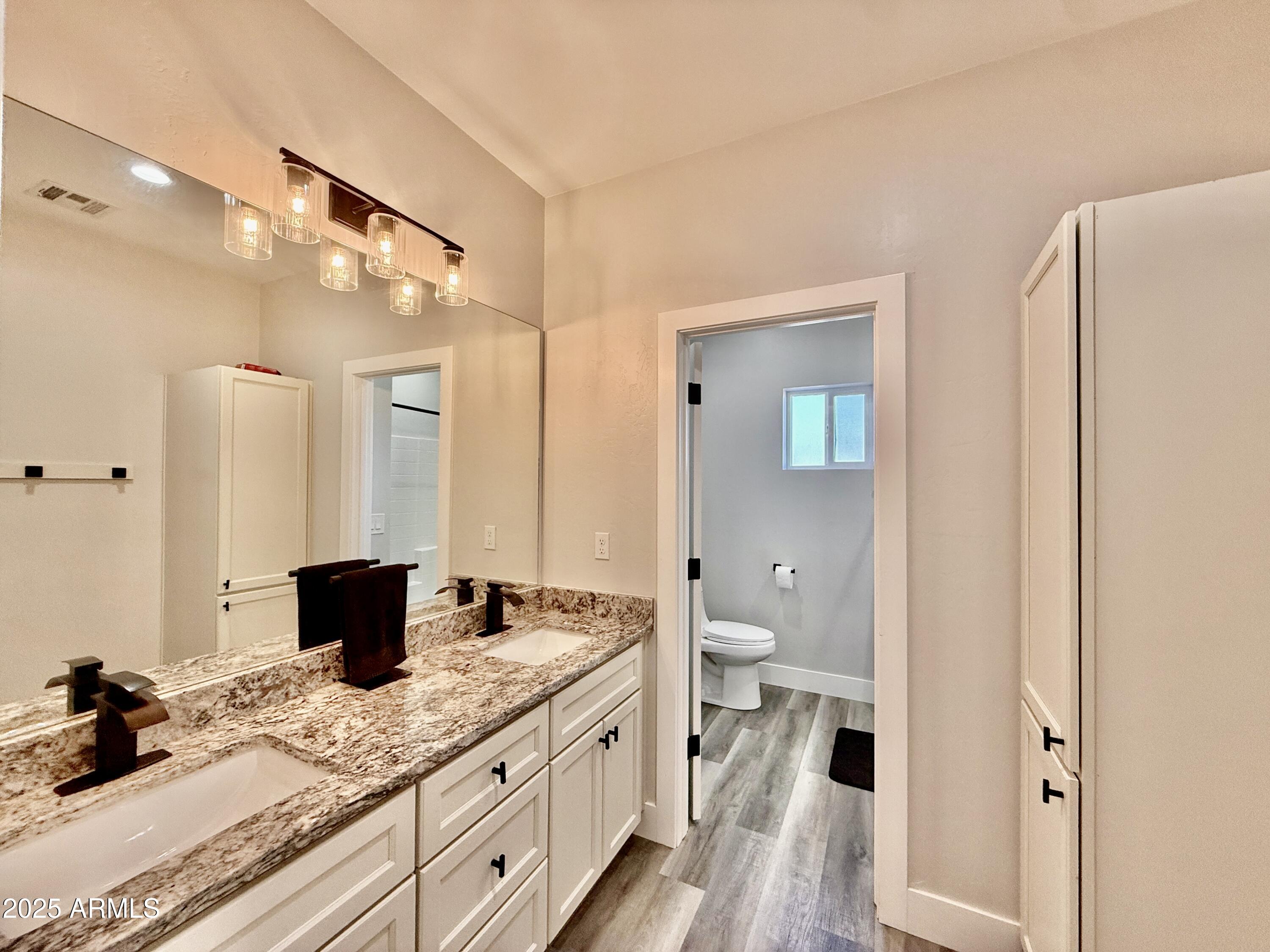 640 South 600 West Pima, AZ 85543 - Photo 14 of 22 a bathroom with a granite countertop sink toilet and shower