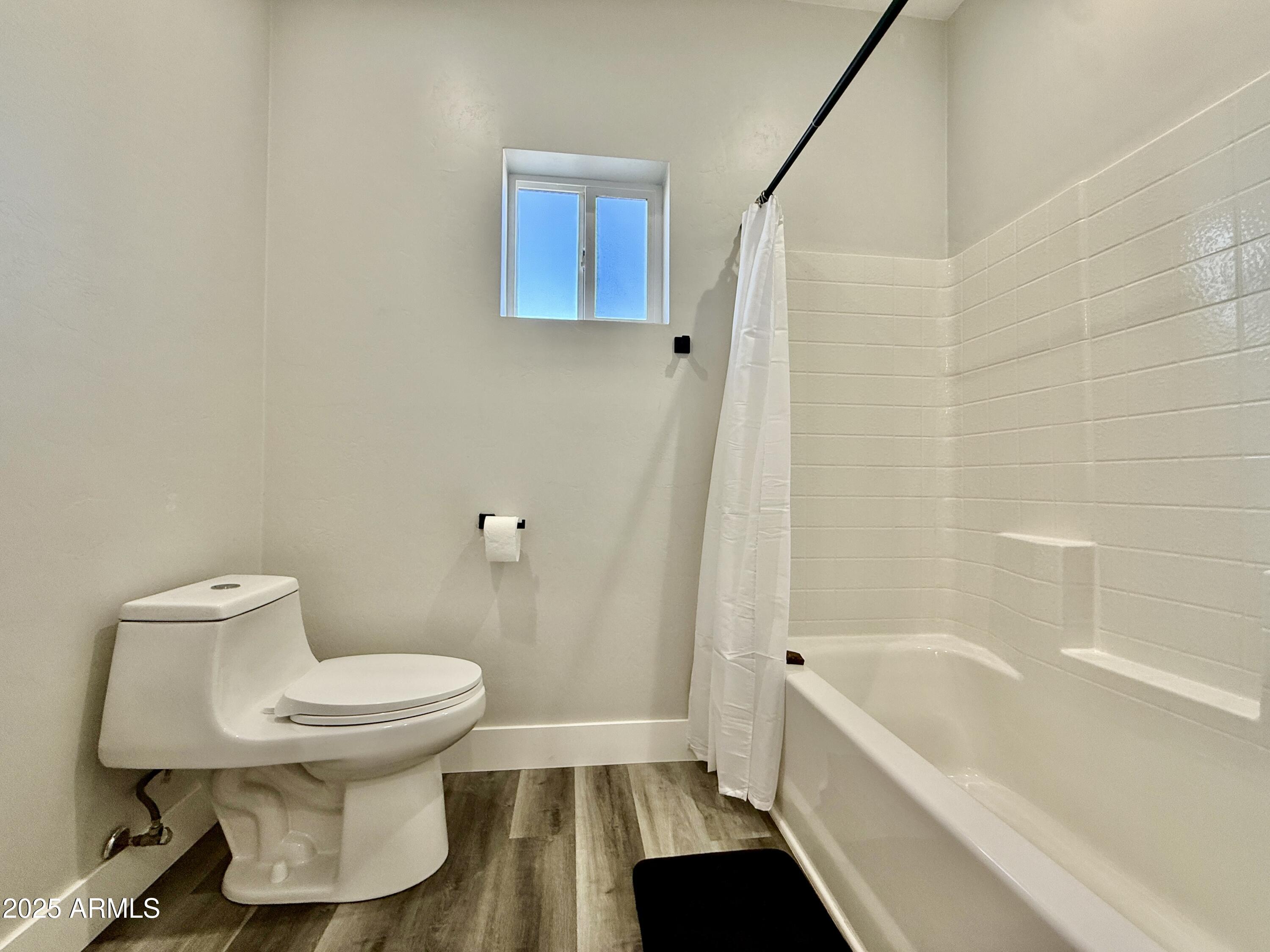 640 South 600 West Pima, AZ 85543 - Photo 16 of 22 a white toilet sitting next to a bath tub