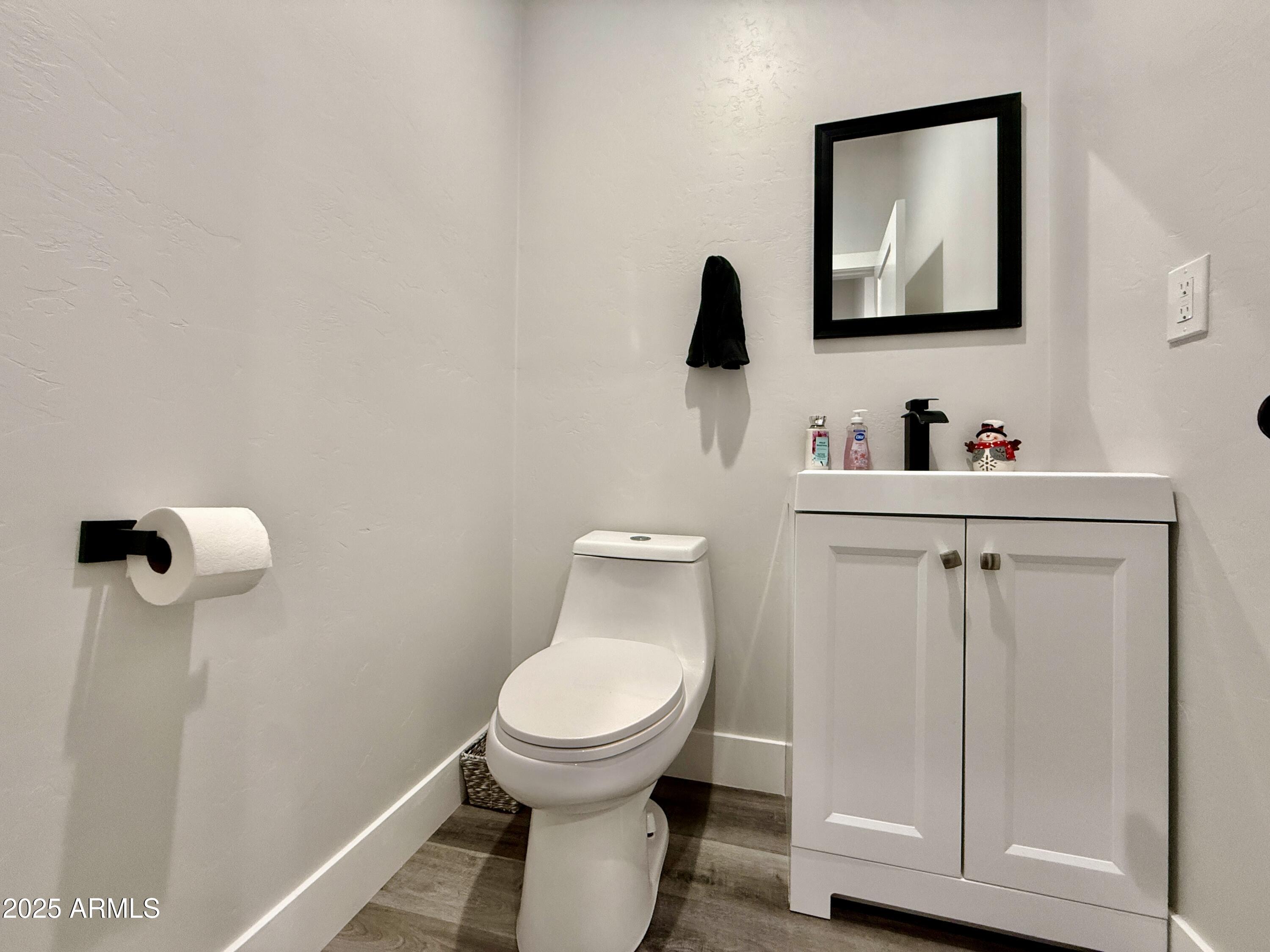 640 South 600 West Pima, AZ 85543 - Photo 18 of 22 a bathroom with a toilet and a sink