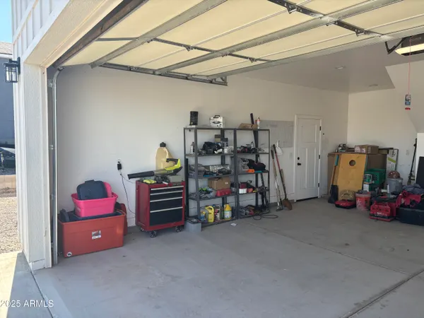 a view of a storage area with shoes and chairs