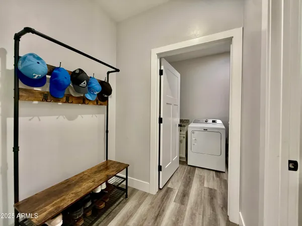 a view of bedroom with a bed and wooden floor