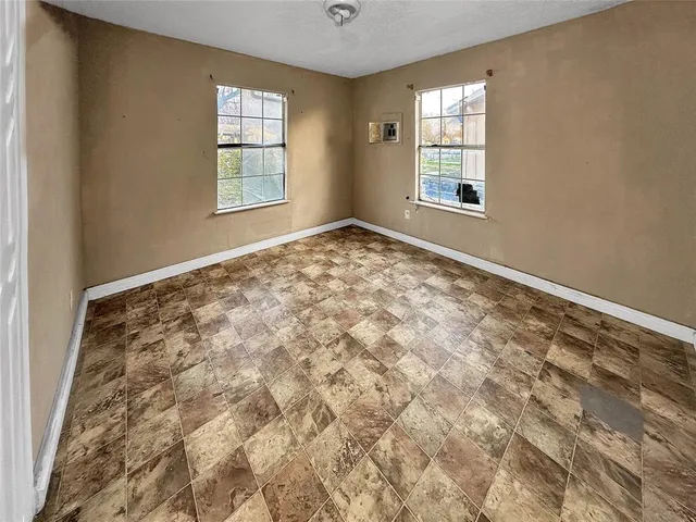 an empty room with windows