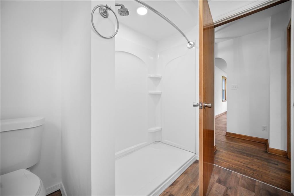 389 Mercer Road Greenville, PA 16125 - Photo 19 of 38 a bathroom with a granite countertop sink a toilet and shower
