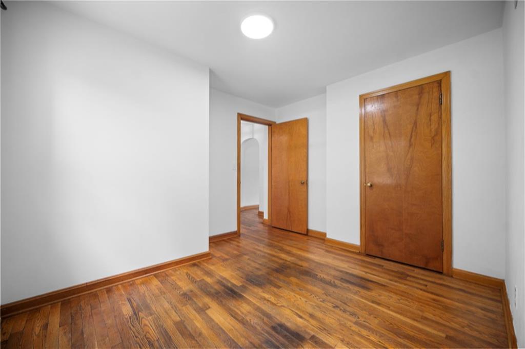 389 Mercer Road Greenville, PA 16125 - Photo 29 of 38 an empty room with wooden floor and closet