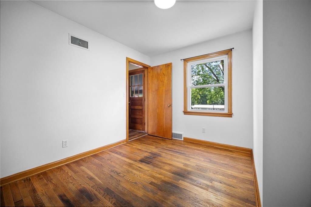 389 Mercer Road Greenville, PA 16125 - Photo 30 of 38 an empty room with wooden floor and windows