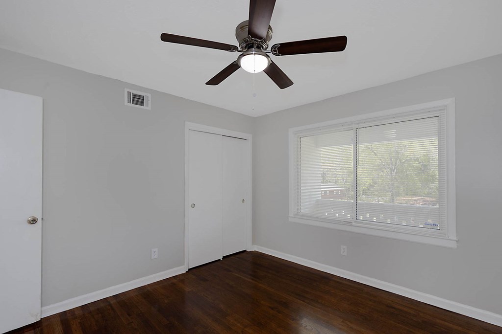 4270 Athens Court Columbus, GA 31907 - Photo 16 of 32 a view of an empty room with wooden floor and a window