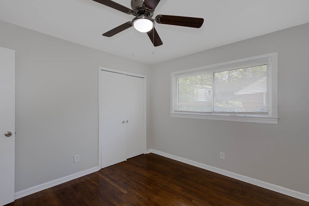 4270 Athens Court Columbus, GA 31907 - Photo 21 of 32 a view of an empty room with wooden floor and a window