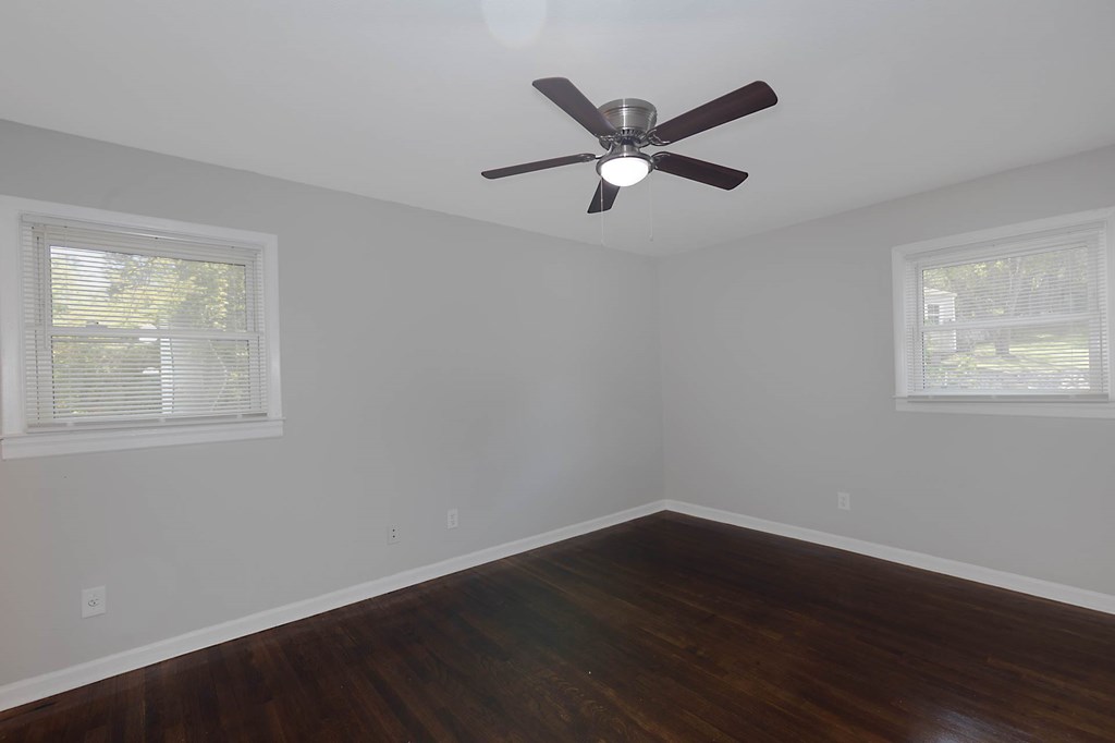 4270 Athens Court Columbus, GA 31907 - Photo 22 of 32 a view of a big room with wooden floor and windows