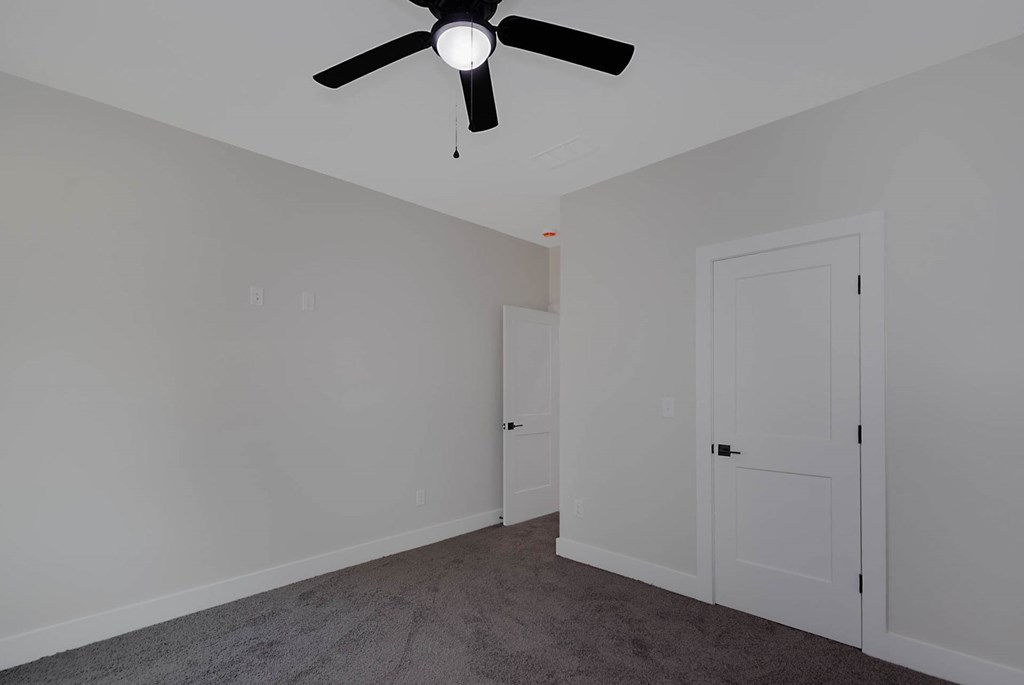 4270 Athens Court Columbus, GA 31907 - Photo 30 of 32 an empty room with a fan & a ceiling fan