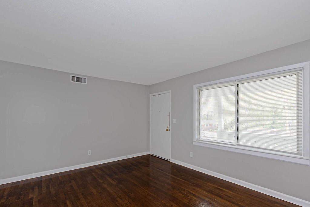 4270 Athens Court Columbus, GA 31907 - Photo 10 of 32 a view of an empty room with wooden floor and a window