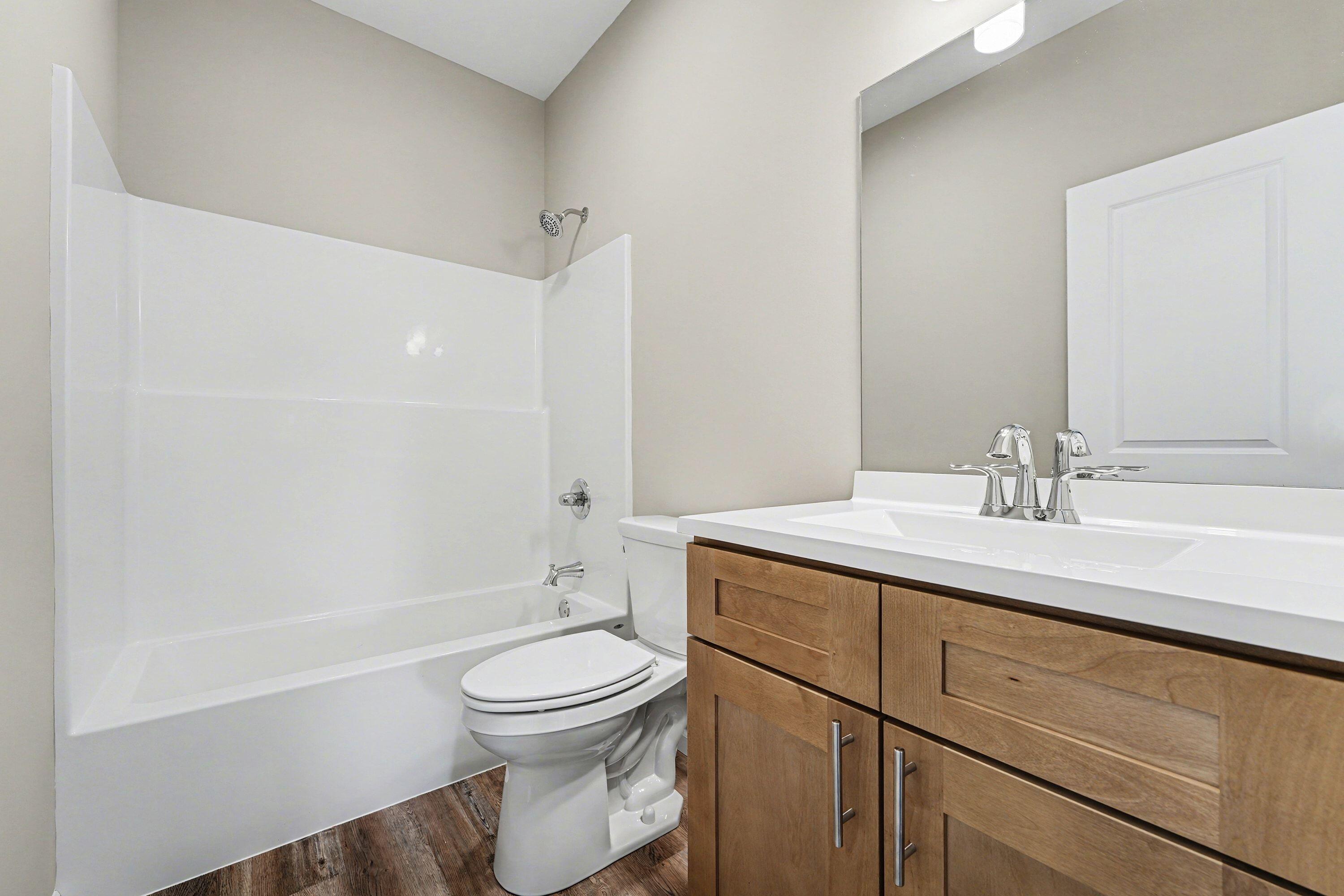 6065 Robbins Road Portage, IN 46368 - Photo 12 of 15 a bathroom with a sink toilet and shower