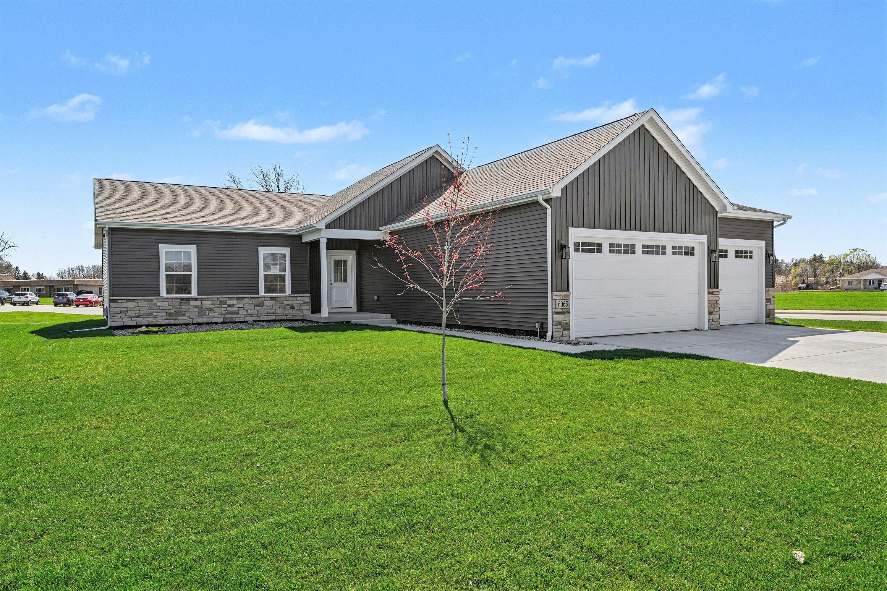 6065 Robbins Road Portage, IN 46368 - Photo 2 of 15 a house that is sitting in the grass