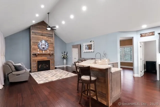 a view of a livingroom with furniture and a fireplace