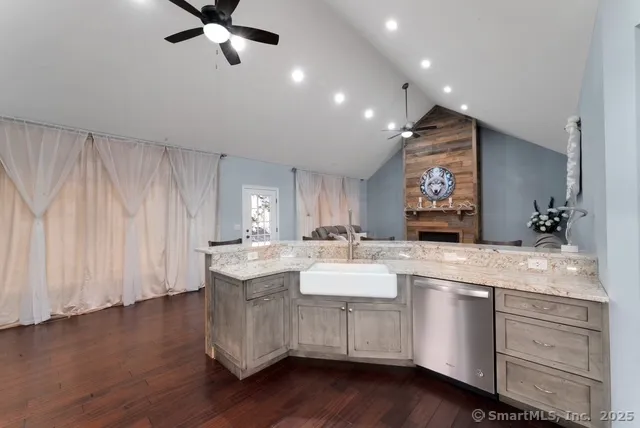 a kitchen with a refrigerator and sink